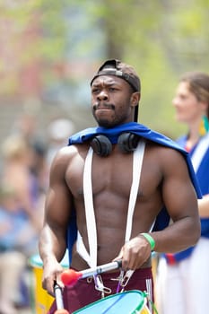 Cleveland, Ohio, USA - June 8, 2019: Parade the Circle, African American man playing the drums during the parade