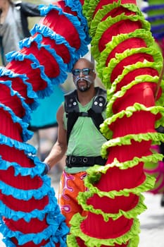 Cleveland, Ohio, USA - June 8, 2019: Parade the Circle, african american man carrying large puppets at the parade