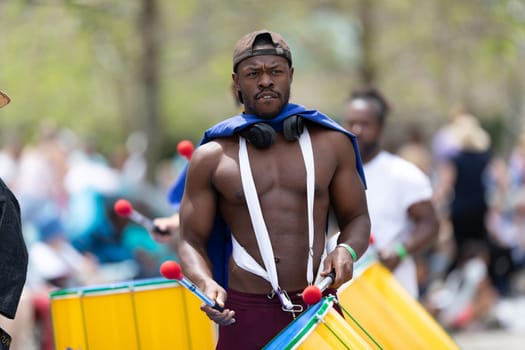 Cleveland, Ohio, USA - June 8, 2019: Parade the Circle, African American man playing the drums during the parade