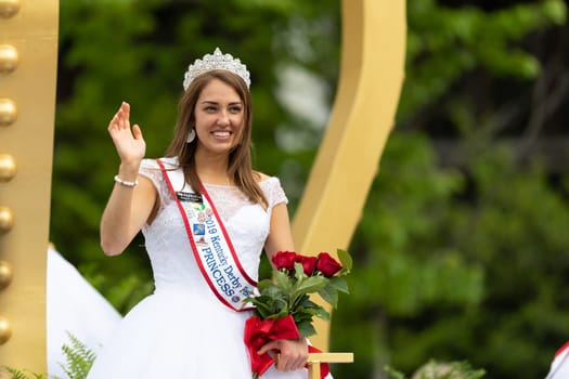 Louisville, Kentucky, USA - May 2, 2019: The Pegasus Parade, Float carrying the Kentucky Derby Royal Court during the parade