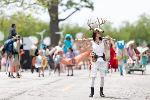 Cleveland, Ohio, USA - June 8, 2019: Parade the Circle, woman wearing a deer face mask