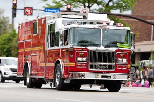Louisville, Kentucky, USA - May 2, 2019: The Pegasus Parade, firetruck from the fire and recue from Louisville , driving down the road during the parade