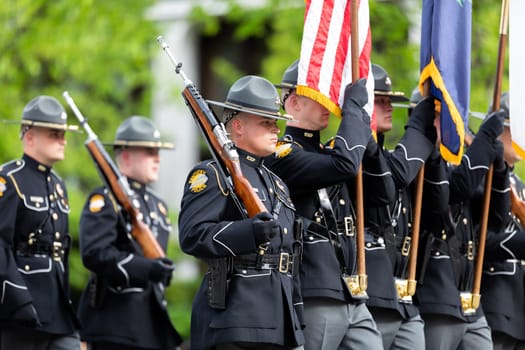 Louisville, Kentucky, USA - May 2, 2019: The Pegasus Parade, Members of the Kentucky State Police escorting the american flag during the parade