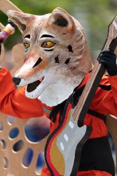 Cleveland, Ohio, USA - June 8, 2019: Parade the Circle, person dress up as a fox with butterflie wings and playing a guitar