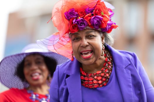 Louisville, Kentucky, USA - May 2, 2019: The Pegasus Parade, African american woman wearing a retro outfit smiling for the camera