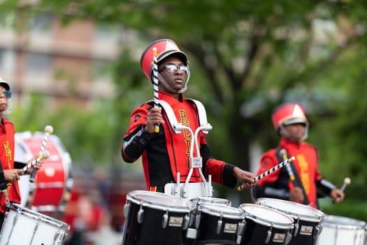 Louisville, Kentucky, USA - May 2, 2019: The Pegasus Parade, Members of the River City Drum Corp performing at the parade
