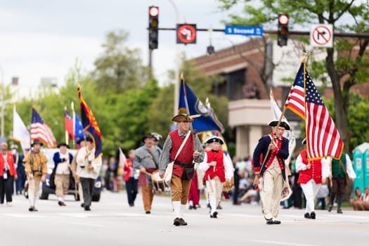 Louisville, Kentucky, USA - May 2, 2019: The Pegasus Parade, Members of the Sons of the American Revolution, wearing traditional clothing marching down the street during the parade