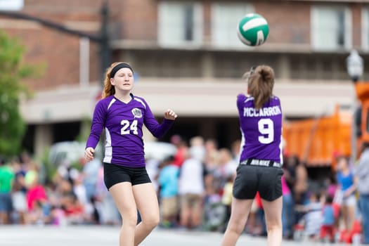Louisville, Kentucky, USA - May 2, 2019: The Pegasus Parade, Members of the Volleyball Academy playing volleyball during the parade