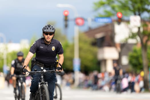 Louisville, Kentucky, USA - May 2, 2019: The Pegasus Parade, Members of the Louisville Metro Police riding bicycles during the parade