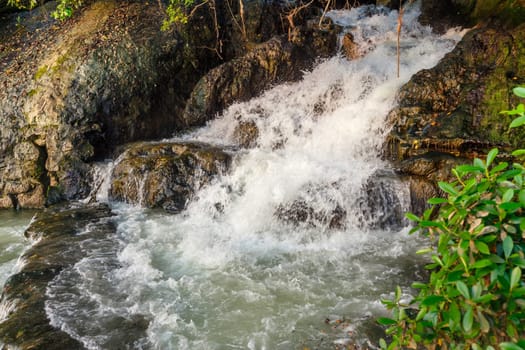 Streams of water from a rocky hill, mountain stream
