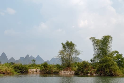 View of the picturesque mountains from the river, Yangshuo, China, Asia