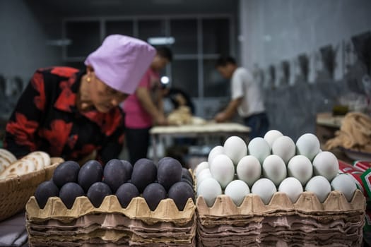 Xian, China -  July 2019 : Local egg vendor and bakery on the street in the Muslim Quarter