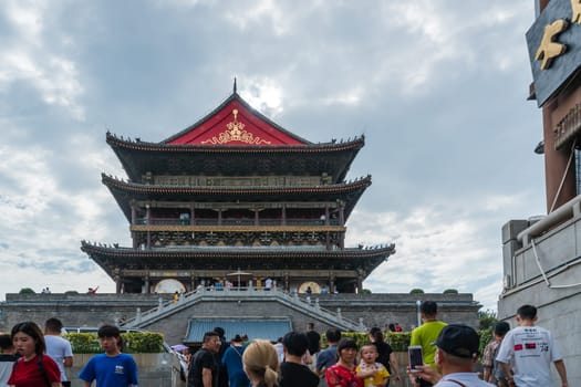 Xian, China -  July 2019 : Tourists in front of the landmark Drum Tower in the city Xian, Shaaxi Province