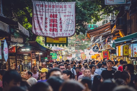 Xian, China -  July 2019 : Crowds visiting the popular street food district called Muslim Quarter in Xian, Shaanxi Province