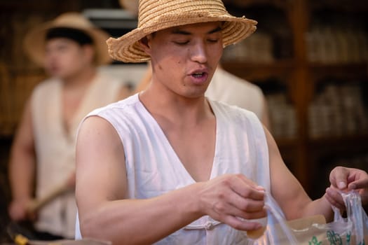 Xian, China -  July 2019 : Traditional local food vendor selling snacks on the street in the Muslim Quarter