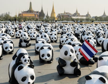 BANGKOK, THAILAND - MARCH 4, 2016: Exhibition of the 1,600 paper-mache panda sculptures world tour collaboration between WWF and French artist Paulo Grangeon at Sanam Luang in Bangkok, Thailand.