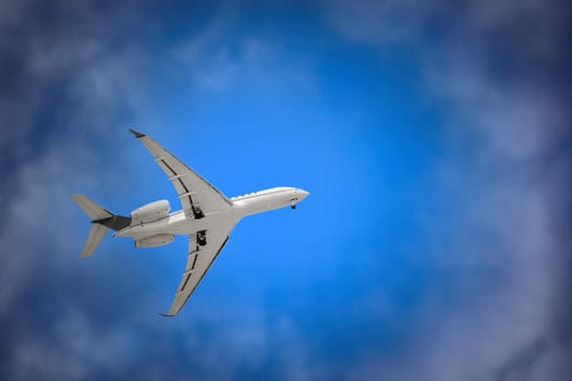 White Plane with Landing Gear in the Sky