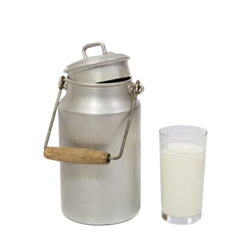 Glass of fresh milk and retro milk canister on white background