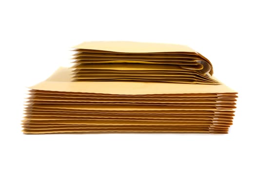 Stack of padded mailing envelopes isolated against a white background