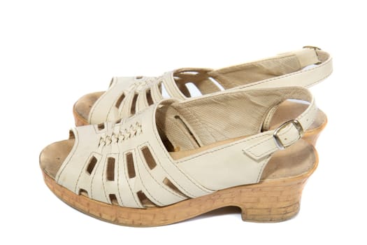 Pair of old women shoes on white background