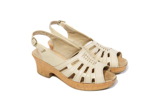 Pair of old women shoes on white background