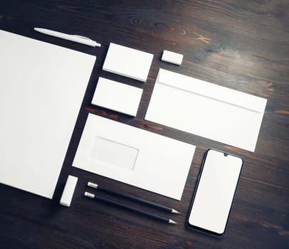Blank corporate stationery set on wood table background. Branding mock up. Template for placing your design.
