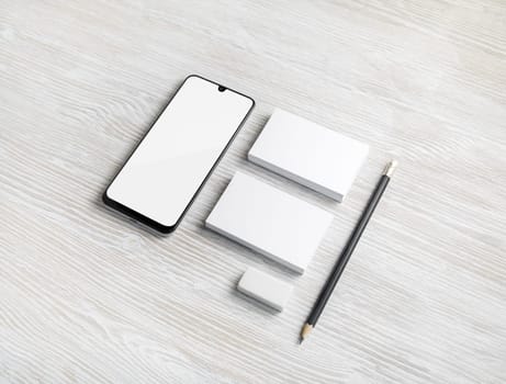 Blank stationery template for placing your design. Smartphone, business cards, pencil and eraser. Mockup for branding identity.