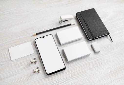 Blank business stationery set. Corporate identity template on light wood table background.