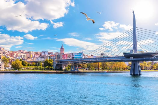 Halic Metro Bridge and Galata Tower on the background, view from the Golden Horn, Istanbul, Turkey.