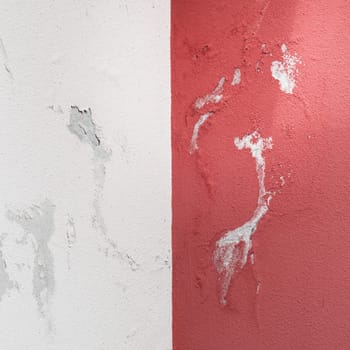 Peeling painted wall, texture, grunge background, cracked paint with red wall.