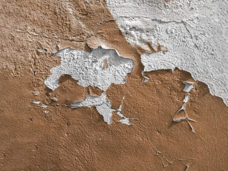 Brown wall with the peeled-off paint. It can be used as background.