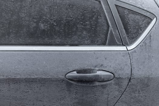 Frozen in the ice black car. Hoarfrost. Icy Accumulation. Ideal for concepts.