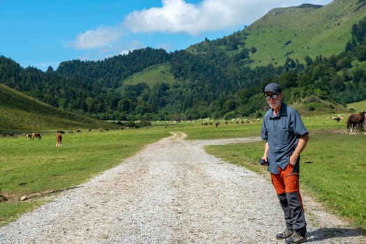 a man hiker walking in the Pyrenees mountain (plateau du benou)