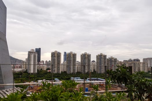 View of the construction of municipal residential buildings in a metropolis from a rooftop cafe, Shenzhen, China, Asia