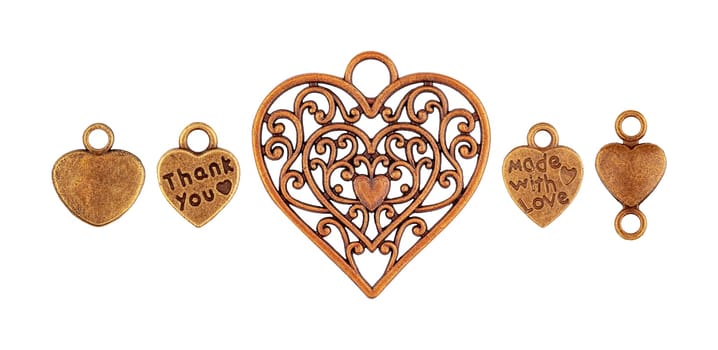 Set of metal old pendants in the shape of a heart isolated