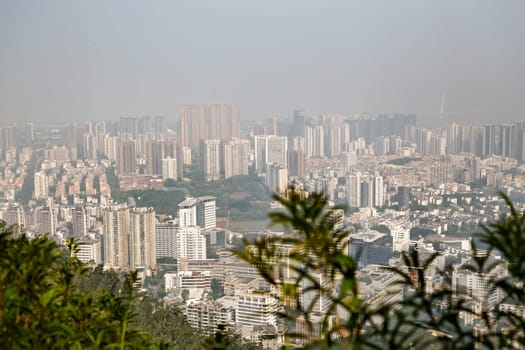 View of the foggy city from the mountains in the early morning, Shenzhen, China, Asia