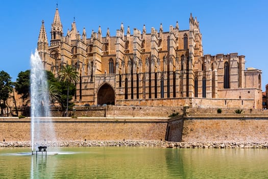 The Cathedral of Santa Maria of Palma in Mallorca with fountain and pond in front, Balearic Islands, Spain