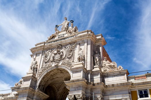 The Augusta Street Triumphal Arch against a beautiful cloudy blue sky
