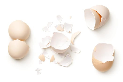 Egg shells isolated on white background. Top view, flat lay