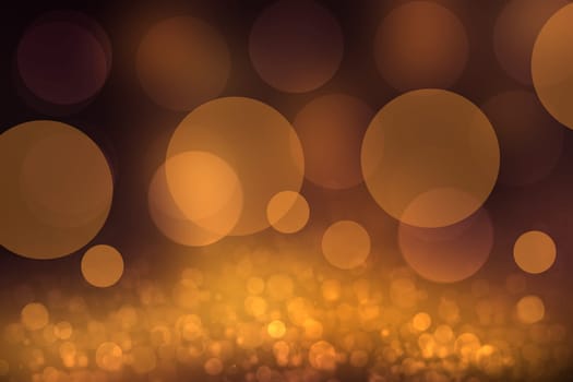 A festive abstract dark golden orange gradient background texture with glitter defocused sparkle bokeh circles. Card concept for Happy New Year, party, invitation, valentine or other holidays.