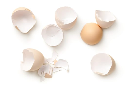 Egg shells isolated on white background. Top view, flat lay