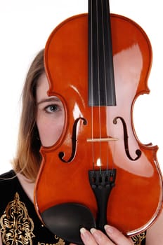 A close up image of a violin and a woman hiding behind just looking.with one eye, isolated for white background.