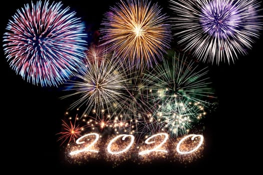 Aparkling number 2020 with fireworks on dark background. Hew Year.