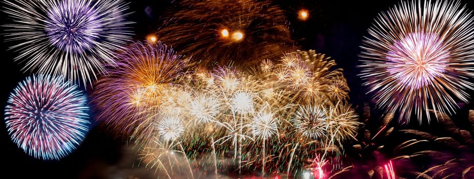 A compilation of fireworks on a long horizontal image.