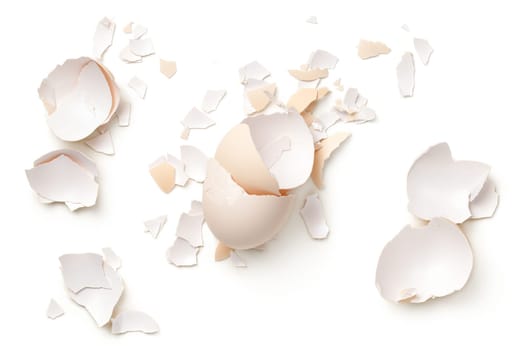 Egg shells isolated on white background. Top view, flat lay