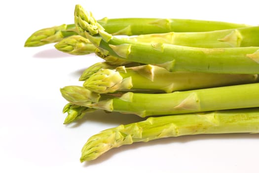 close up Fresh green asparagus on background