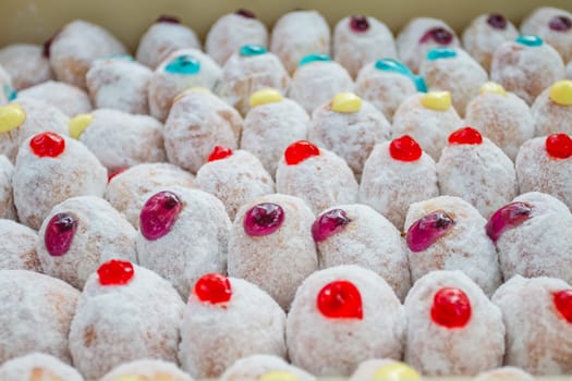 closeup Delicious a lot of donuts with icing