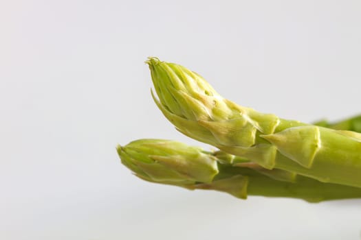 close up Fresh green asparagus on background