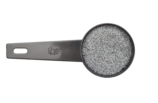 Poppy seeds in measuring spoon on white background