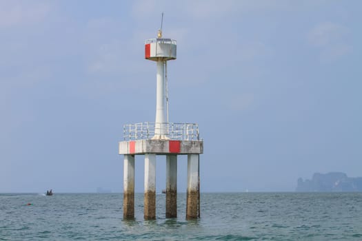 lighthouse in the sea, lighthouse warning in the sea